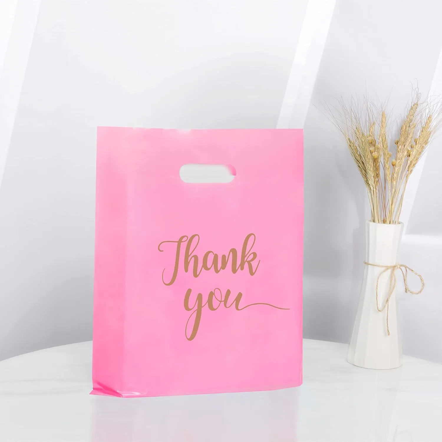MUKOSEL 100Pcs Thank You Merchandise Bags, Extra Thick 2.36 Mil 12x15 In Retail Shopping Bags for Goodie bags Party Stores Boutique Clothes Business Gift, Reusable Plastic Bags with Handle (Pink Gold Text)