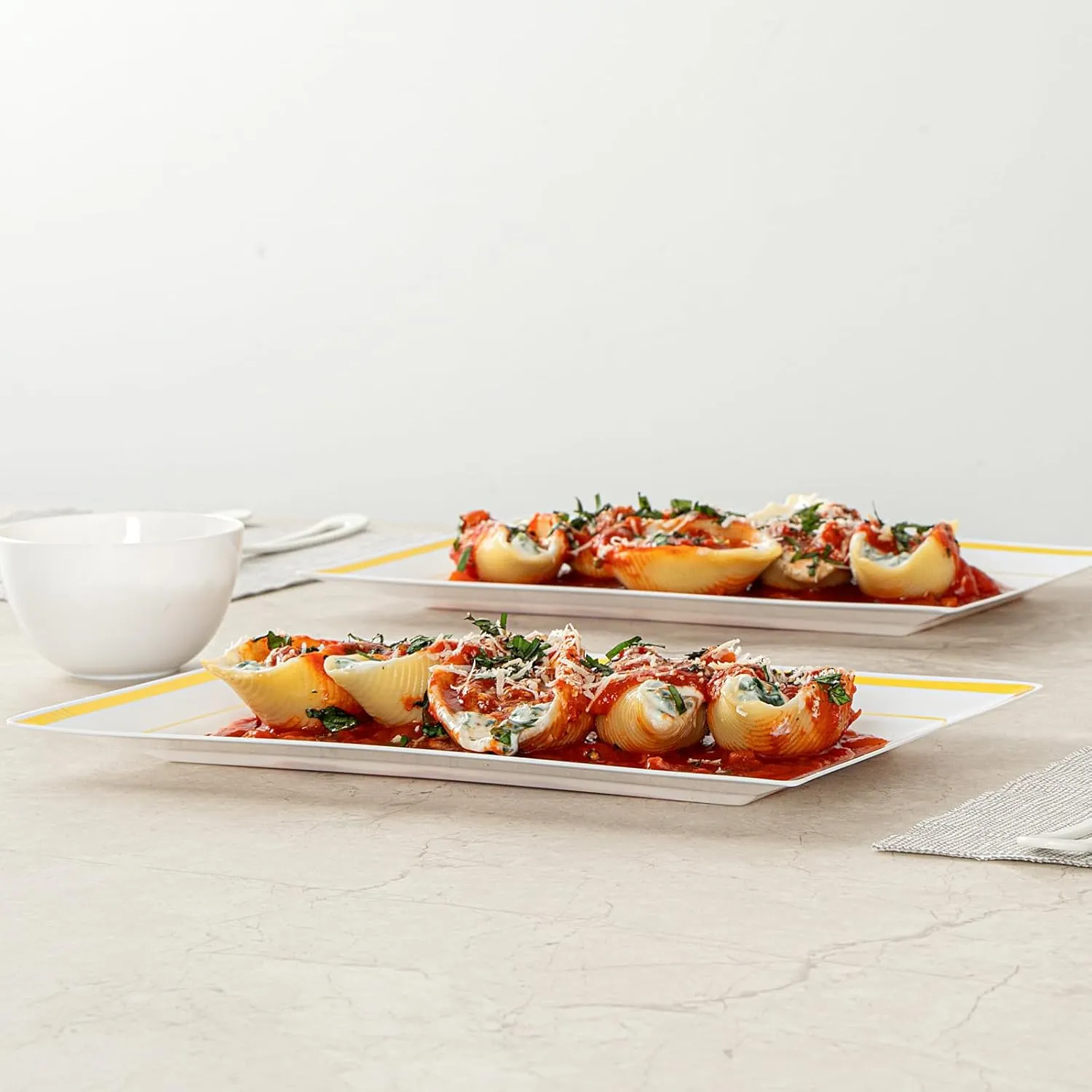 Restaurantware Moderna 9.5 x 6.3 Inch Premium Disposable Plates 100 Rectangular Plastic Plates For Parties - Gold-Rimmed Durable White Plastic Dinner Plates For Warm And Cold Foods
